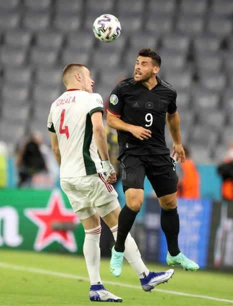 Kevin Volland of germany vies with Attila Arpad Szalai of Hungary during the UEFA Euro 2020 Championship Group F match between Germany and Hungary at...