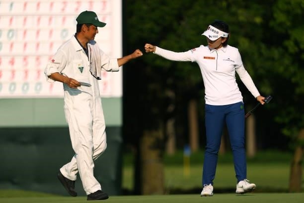 Teresa Lu of Chinese Taipei fist bumps with her caddie after the birdie on the 9th green during the first round of the Earth Mondamin Cup at Camellia...