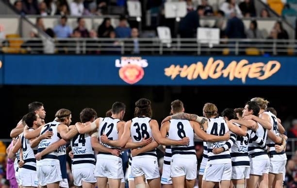 The Geelong players embrace during the round 14 AFL match between the Brisbane Lions and the Geelong Cats at The Gabba on June 24, 2021 in Brisbane,...