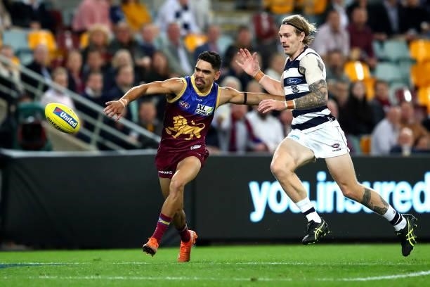 Charlie Cameron of the Lions competes with Tom Stewart of the Cats during the round 14 AFL match between the Brisbane Lions and the Geelong Cats at...