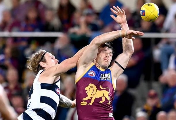 Lincoln McCarthy of the Lions and Tom Stewart of the Cats challenge for the ball during the round 14 AFL match between the Brisbane Lions and the...