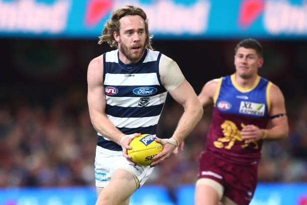 Cameron Guthrie of the Cats runs the ball during the round 14 AFL match between the Brisbane Lions and the Geelong Cats at The Gabba on June 24, 2021...