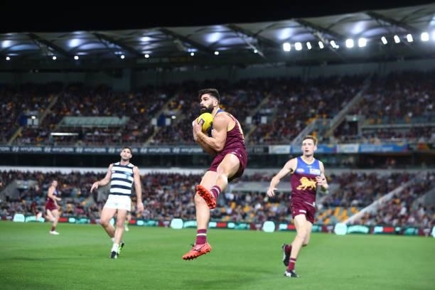Marcus Adams of the Lions marks during the round 14 AFL match between the Brisbane Lions and the Geelong Cats at The Gabba on June 24, 2021 in...
