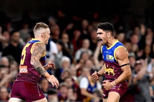 Charlie Cameron of the Lions celebrates after kicking a goal during the round 14 AFL match between the Brisbane Lions and the Geelong Cats at The...