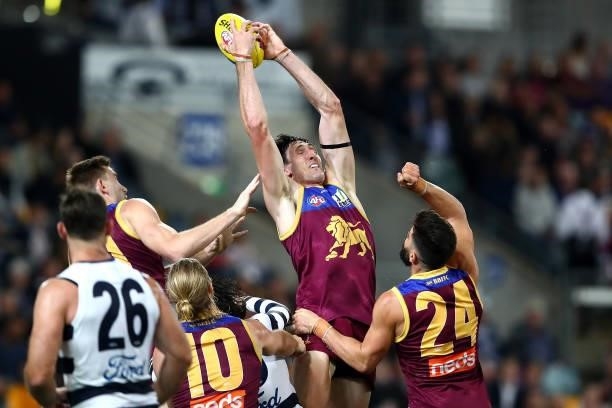 Oscar McInerney of the Lions marks the ball during the round 14 AFL match between the Brisbane Lions and the Geelong Cats at The Gabba on June 24,...