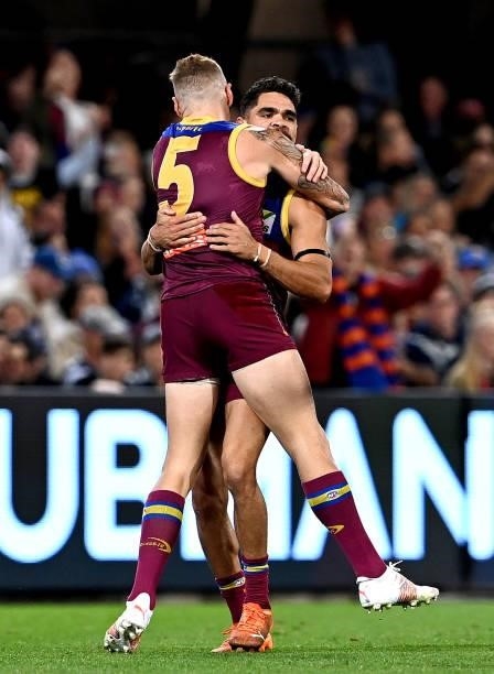 Charlie Cameron of the Lions celebrates with team mate Mitch Robinson after kicking a goal during the round 14 AFL match between the Brisbane Lions...