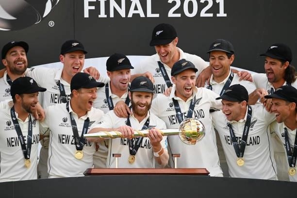 Kane Williamson of New Zealand lifts the ICC World Test Championship Mace with teammates after victory in the Reserve Day of the ICC World Test...