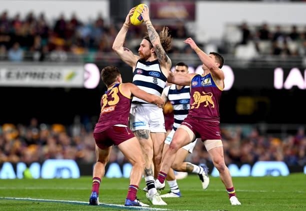 Zach Tuohy of the Cats attempts to break away from the defence during the round 14 AFL match between the Brisbane Lions and the Geelong Cats at The...