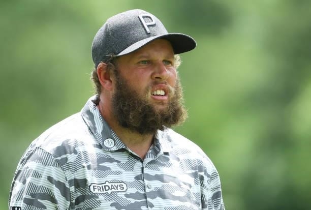Andrew Johnston of England plays his second shot on the ninth hole during the first round of The BMW International Open at Golfclub Munchen...