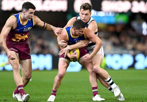 Dayne Zorko of the Lions is caught with the ball during the round 14 AFL match between the Brisbane Lions and the Geelong Cats at The Gabba on June...