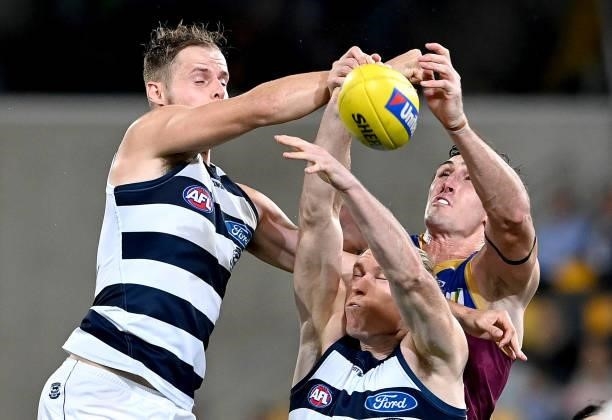 Oscar McInerney of the Lions and Jake Kolodjashnij of the Cats compete for the ball during the round 14 AFL match between the Brisbane Lions and the...