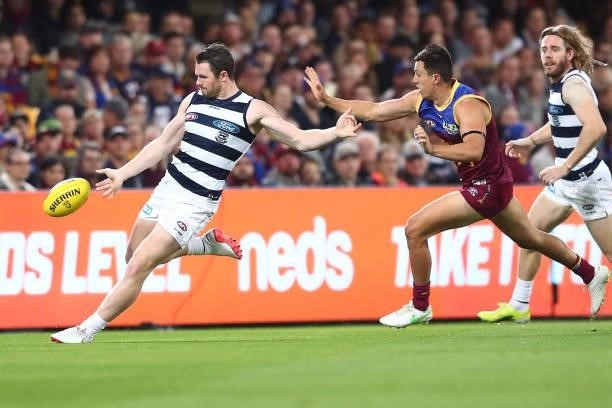 Patrick Dangerfield of the Cats kicks during the round 14 AFL match between the Brisbane Lions and the Geelong Cats at The Gabba on June 24, 2021 in...