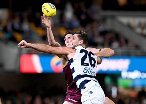 Oscar McInerney of the Lions and Tom Hawkins of the Cats challenge for the ball during the round 14 AFL match between the Brisbane Lions and the...
