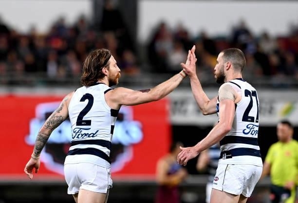 Zach Tuohy of the Cats celebrates after kicking a goal during the round 14 AFL match between the Brisbane Lions and the Geelong Cats at The Gabba on...