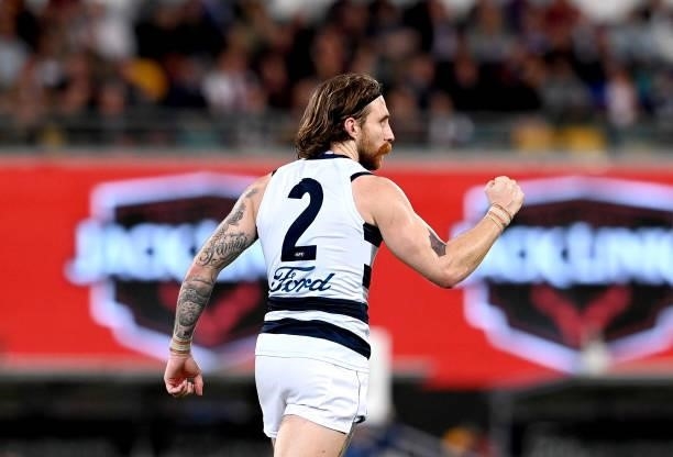 Zach Tuohy of the Cats celebrates after kicking a goal during the round 14 AFL match between the Brisbane Lions and the Geelong Cats at The Gabba on...