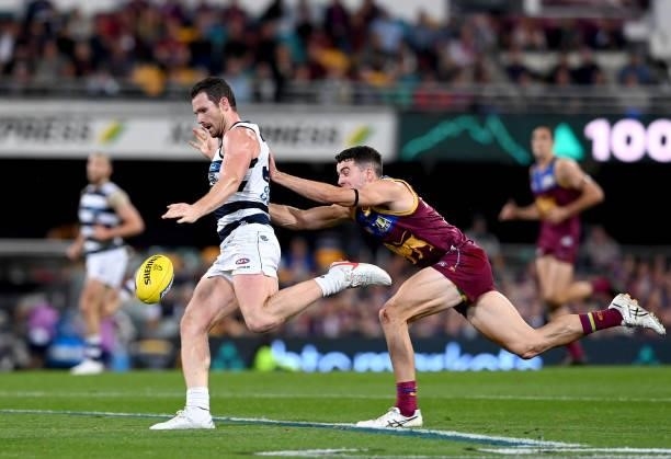 Patrick Dangerfield of the Cats breaks away from the defence during the round 14 AFL match between the Brisbane Lions and the Geelong Cats at The...
