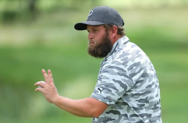 Andrew Johnston of England acknowledges the crowd on the ninth green during the first round of The BMW International Open at Golfclub Munchen...