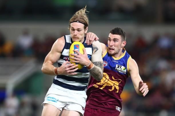 Tom Stewart of the Cats marks during the round 14 AFL match between the Brisbane Lions and the Geelong Cats at The Gabba on June 24, 2021 in...