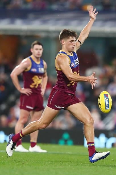 Zac Bailey of the Lions kicks during the round 14 AFL match between the Brisbane Lions and the Geelong Cats at The Gabba on June 24, 2021 in...