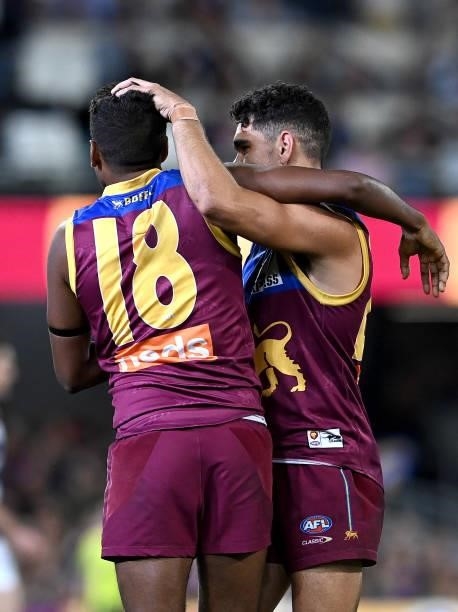 Keidean Coleman of the Lions is congratulated by team mate Charlie Cameron after kicking a goal during the round 14 AFL match between the Brisbane...