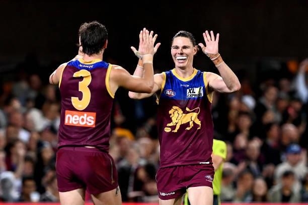 Eric Hipwood of the Lions celebrates with team mate Joe Daniher after kicking a goal during the round 14 AFL match between the Brisbane Lions and the...