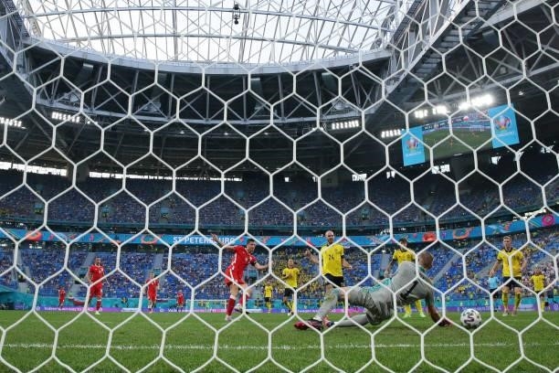 Robert Lewandowski of Poland scores their second goal during the UEFA Euro 2020 Championship Group E match between Sweden and Poland at Saint...