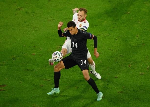 Jamal Musiala of Germany is challenged by Gergo Lovrencsics of Hungary during the UEFA Euro 2020 Championship Group F match between Germany and...