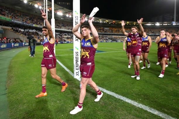 The Lions celebrate the win after the round 14 AFL match between the Brisbane Lions and the Geelong Cats at The Gabba on June 24, 2021 in Brisbane,...