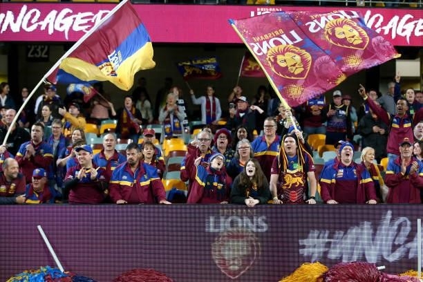 Lions fans cheer during the round 14 AFL match between the Brisbane Lions and the Geelong Cats at The Gabba on June 24, 2021 in Brisbane, Australia.