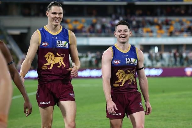 Eric Hipwood of the Lions and Lachie Neale celebrate winning the round 14 AFL match between the Brisbane Lions and the Geelong Cats at The Gabba on...
