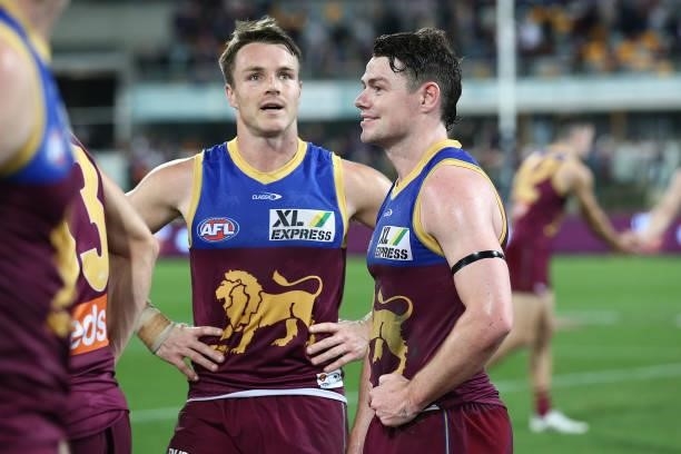Lincoln McCarthy of the Lions and Lachie Neale celebrate winning the round 14 AFL match between the Brisbane Lions and the Geelong Cats at The Gabba...