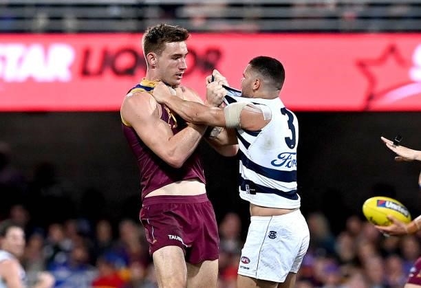 Harris Andrews of the Lions and Brandan Parfitt of the Cats show their frustrations during the round 14 AFL match between the Brisbane Lions and the...