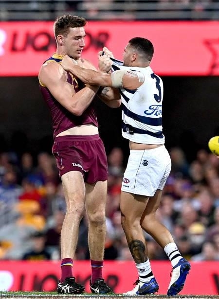 Harris Andrews of the Lions and Brandan Parfitt of the Cats show their frustrations during the round 14 AFL match between the Brisbane Lions and the...