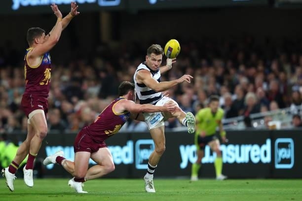 Shaun Higgins of the Cats kicks the ball during the round 14 AFL match between the Brisbane Lions and the Geelong Cats at The Gabba on June 24, 2021...