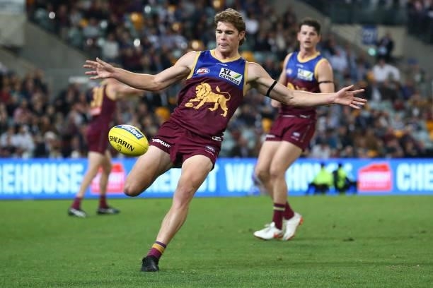 Deven Robertson of the Lions kicks the ball during the round 14 AFL match between the Brisbane Lions and the Geelong Cats at The Gabba on June 24,...