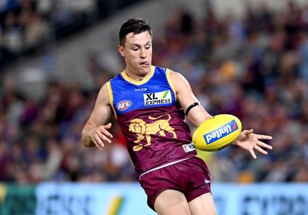 Hugh McCluggage of the Lions kicks the ball during the round 14 AFL match between the Brisbane Lions and the Geelong Cats at The Gabba on June 24,...