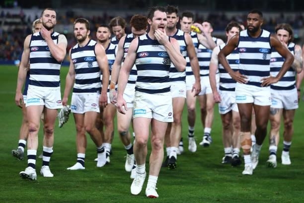 Patrick Dangerfield and the Cats leave the field after losing the round 14 AFL match between the Brisbane Lions and the Geelong Cats at The Gabba on...