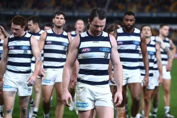 Patrick Dangerfield and the Cats leave the field after losing the round 14 AFL match between the Brisbane Lions and the Geelong Cats at The Gabba on...
