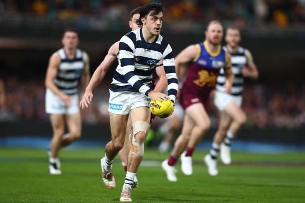 Brad Close of the Cats kicks during the round 14 AFL match between the Brisbane Lions and the Geelong Cats at The Gabba on June 24, 2021 in Brisbane,...