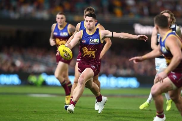 Lachie Neale of the Lions kicks during the round 14 AFL match between the Brisbane Lions and the Geelong Cats at The Gabba on June 24, 2021 in...