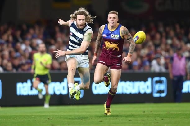 Cameron Guthrie of the Cats kicks during the round 14 AFL match between the Brisbane Lions and the Geelong Cats at The Gabba on June 24, 2021 in...