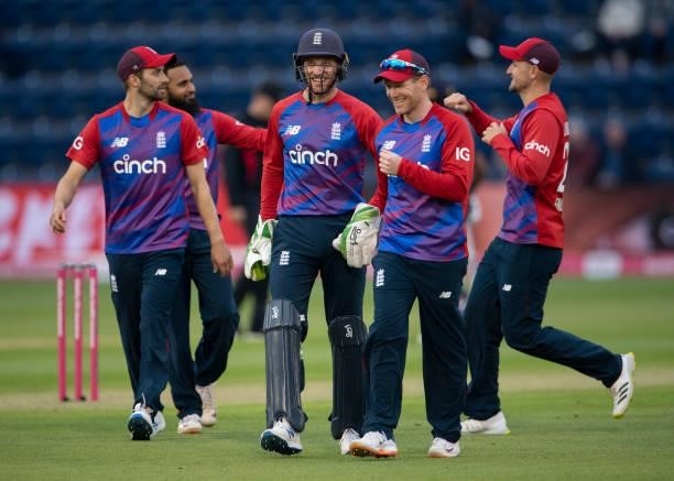 England captain Eoin Morgan, Jos Buttler and team mates celebrate Chris Jordan catching Kusal Perera of Sri Lanka off the bowling of Adil Rashid...