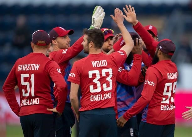 England bowler Mark Wood celebrates with team mates after taking the wicket of Dhananjaya de Silva of Sri Lanka during the 1st T20I between England...