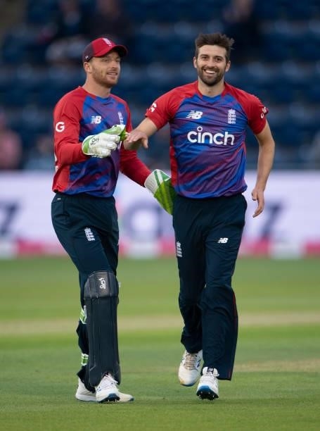 England bowler Mark Wood celebrates with team mate Jos Buttler after taking the wicket of Dhananjaya de Silva of Sri Lanka during the 1st T20I...