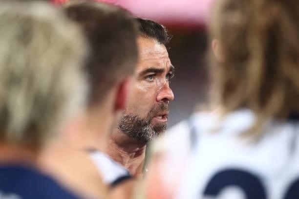 Cats Coach Chris Scott talks to players during the round 14 AFL match between the Brisbane Lions and the Geelong Cats at The Gabba on June 24, 2021...