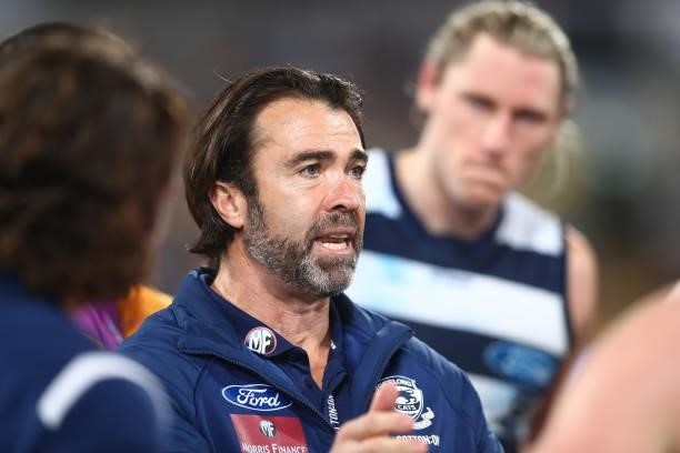 Cats Coach Chris Scott talks to players during the round 14 AFL match between the Brisbane Lions and the Geelong Cats at The Gabba on June 24, 2021...