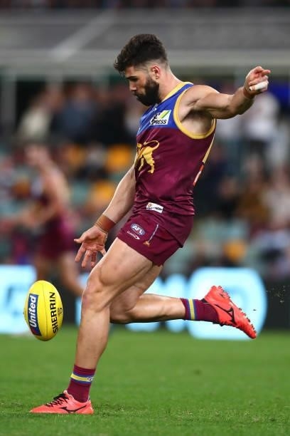 Marcus Adams of the Lions kicks during the round 14 AFL match between the Brisbane Lions and the Geelong Cats at The Gabba on June 24, 2021 in...