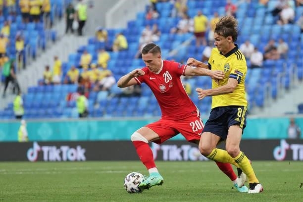 Piotr Zielinski of Poland competes for the ball with Albin Ekdal of Sweden during the UEFA Euro 2020 Championship Group E match between Sweden and...