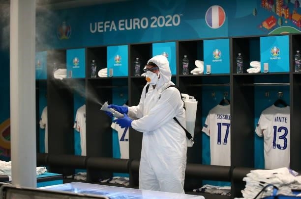 Worker sanitises the France team dressing room prior to the UEFA Euro 2020 Championship Group F match between Portugal and France at Puskas Arena on...