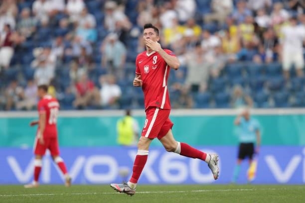 Robert Lewandowski of Poland celebrates scoring their opening goal during the UEFA Euro 2020 Championship Group E match between Sweden and Poland at...